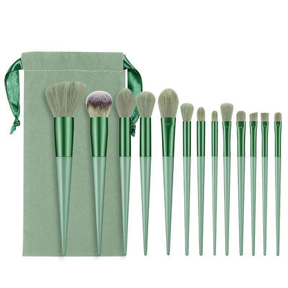 A set of thirteen makeup brushes