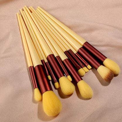A set of thirteen makeup brushes