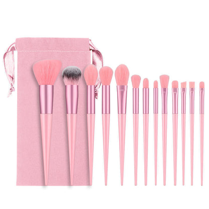 A set of thirteen makeup brushes