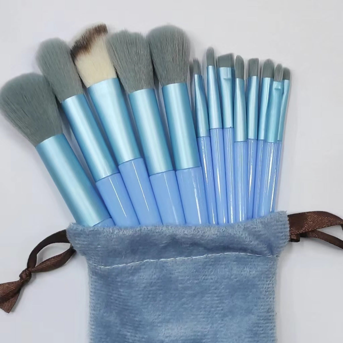 A set of thirteen makeup brushes