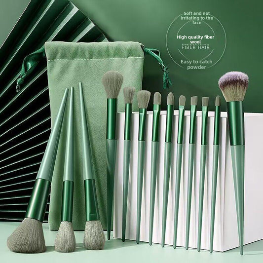A set of thirteen makeup brushes