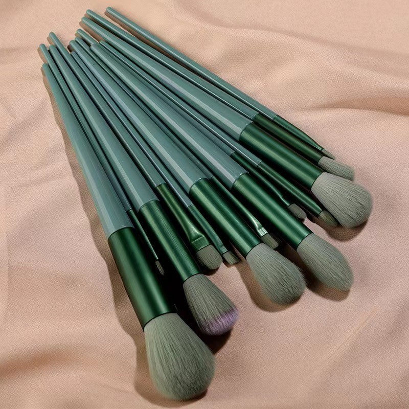 A set of thirteen makeup brushes