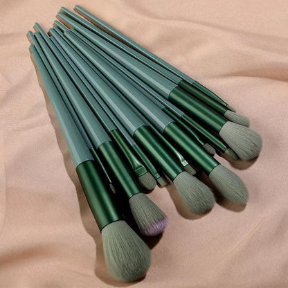 A set of thirteen makeup brushes