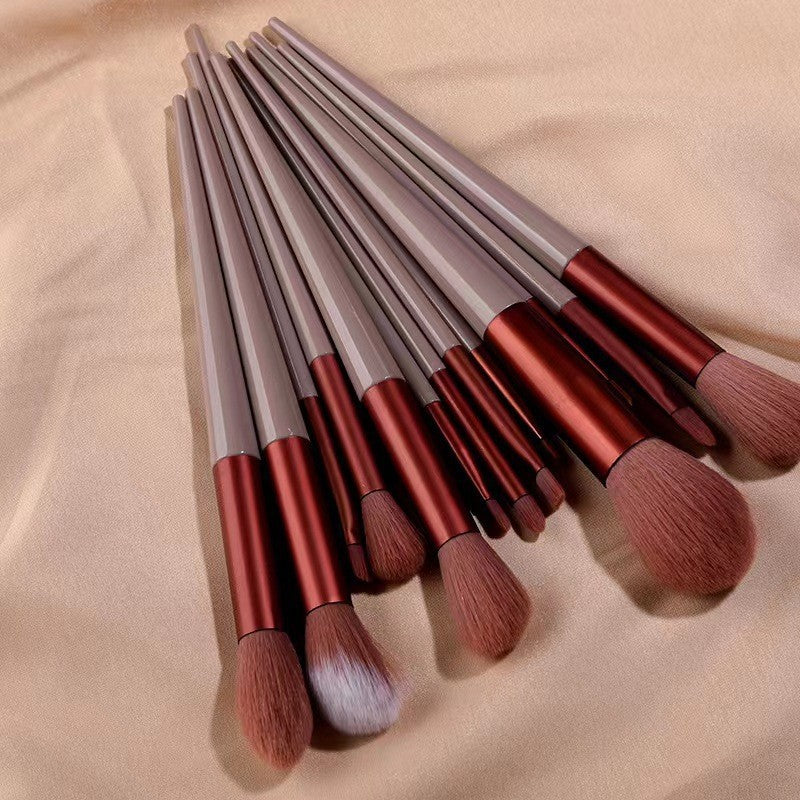 A set of thirteen makeup brushes