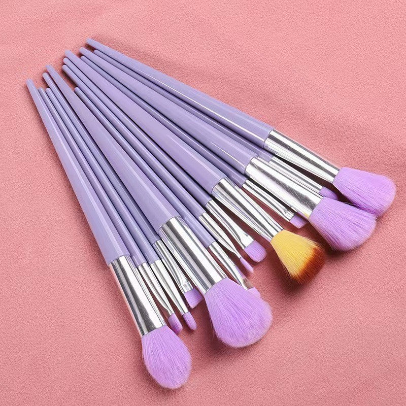 A set of thirteen makeup brushes