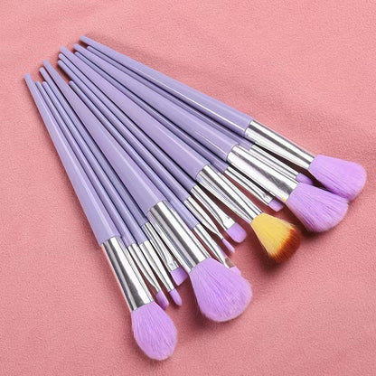 A set of thirteen makeup brushes